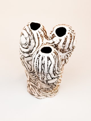 photograph of earthen ceramic sculpture, hand painted with patterns, aerial view, thumbnail